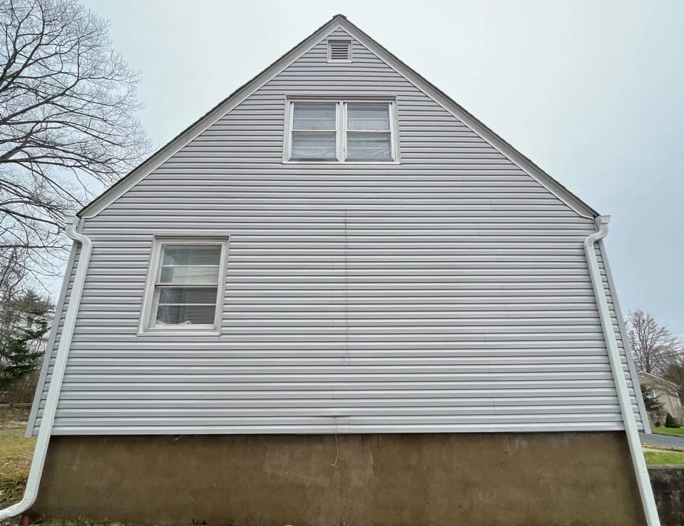 Parma Power Washing technician performing detailed house washing in Parma residential area